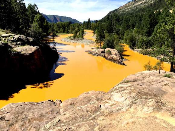 Jerry McBride/Durango Herald08/06/15-Durango - Mine waste from the Gold King Mine north of Silverton fills the Animas River at Bakers Bridge on Thursday morning.